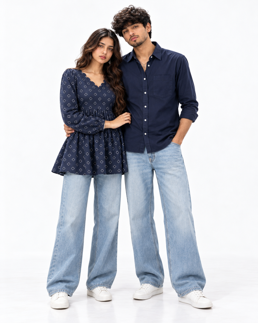 Navy Denim Matching Couple Set - Full-Length Editorial Hero Studio Shot (Kabir & Tara, Tara on Viewer-Left in Deep Navy Booti Peplum Kurti & Relaxed Wide-Leg Denim, Kabir on Viewer-Right in Deep Navy Cotton Shirt & Wide-Leg Denim, Unsmiling Editorial Poise, Pure White Studio)